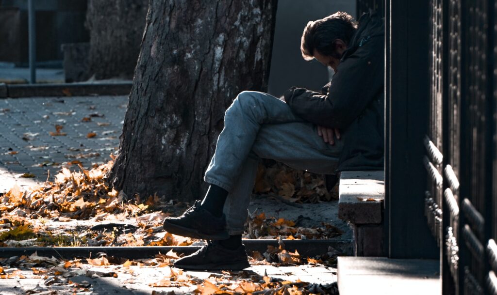 addict sitting on bench