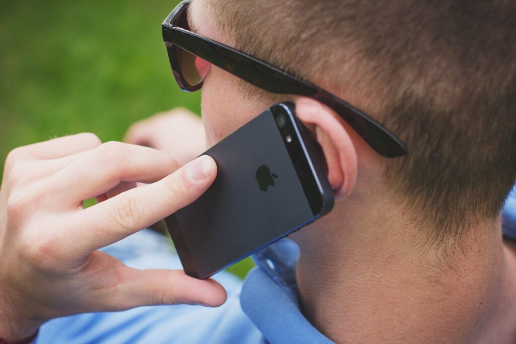 man making phone call to support helpline