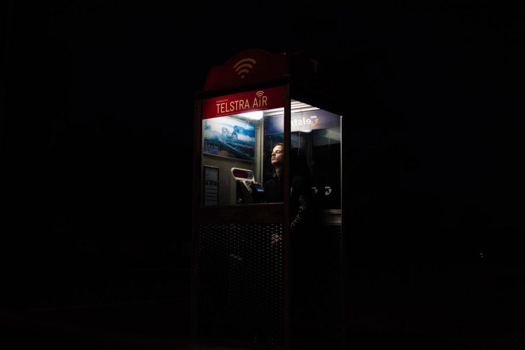person in telephone box
