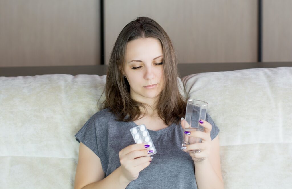 Woman taking pills