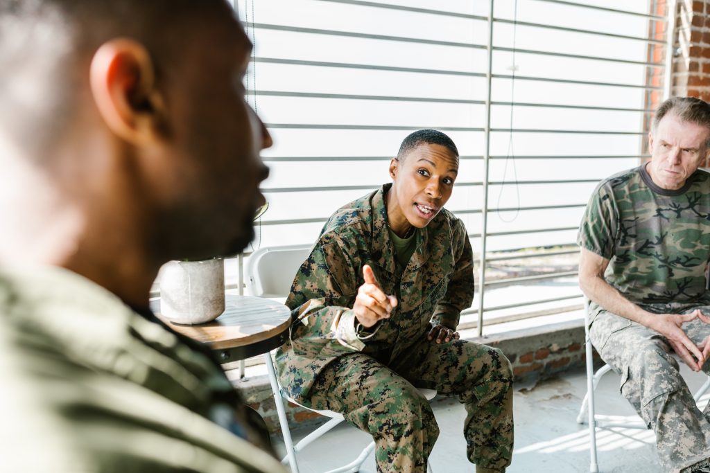 A group of military veterans in a counseling session.